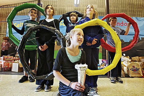 &lt;p&gt;D'Anna Thorton, 11, holds the &quot;Olympic torch&quot; while her classmates carry the Olympic rings behind her Wednesday as the Seltice Elementary students give their presentation to 2012 K-5 Food Drive Challenge judges. Also photographed, from left, are Mikelli Villasenor, 11, Danielle Meeks, 10, Ridge Lovett, 11, Alyssa Gernert, 10, and Cameron Sessions, 9.&lt;/p&gt;