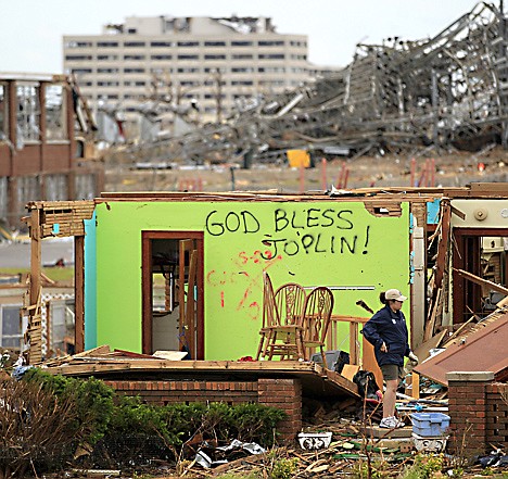&lt;p&gt;Ashley Clark salvages items from a family member's devastated Joplin, Mo. home Wednesday, May 25, 2011. An EF-5 tornado tore through much of the city Sunday, damaging a hospital and hundreds of homes and businesses and killing at least 122 people.&lt;/p&gt;