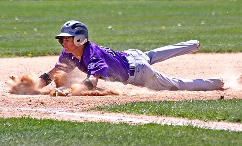 The Mission Valley Rockies' Justin Hoel slides into third base last Saturday in Polson.