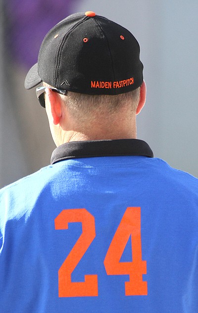 Maidens coach Steve Woll wears royal blue to show his support for Ronan head softball coach Tom Peterson.