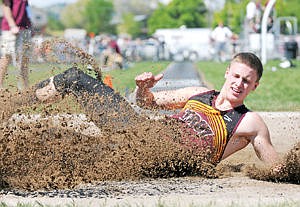 &lt;p&gt;Troy's Scott Pate crashes into the pit during the long jump at the Class B state track and field championship in Kalispell on Friday. Pate finished in second with a jump of 20 feet, 11.5 inches. (Aaric Bryan/Daily Inter Lake)&lt;/p&gt;