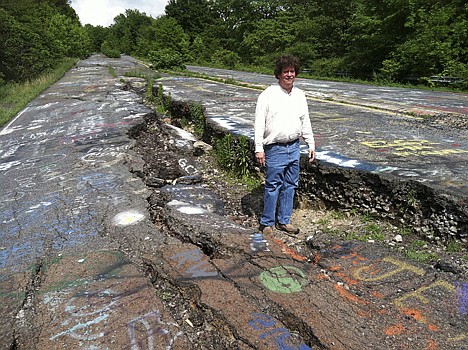 &lt;p&gt;David DeKok poses on abandoned Route 61 in Centralia, Pa., on Thursday. Fifty years ago on Sunday, a fire at the town dump spread to a network of coal mines underneath hundreds of homes and business in the northeastern Pennsylvania borough of Centralia, eventually forcing the demolition of nearly every building.&lt;/p&gt;