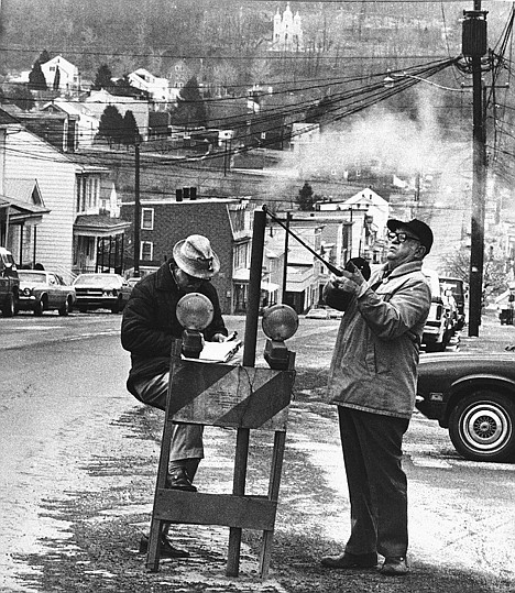 &lt;p&gt;In this April 1981 photo, U.S. Bureau of Mines' John Stockalis, right, and Dan Lewis drop a thermometer through a hole on Main Street in Centralia, Pa., to measure the heat from a shaft mine blaze that burns under the town.&lt;/p&gt;