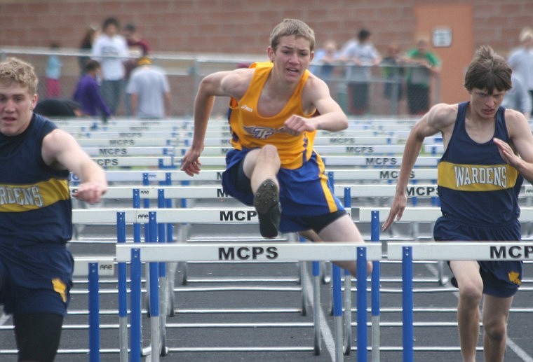 Preston Chubert clears a hurdle in the 110 hurdles at Divisionals in Missoula.