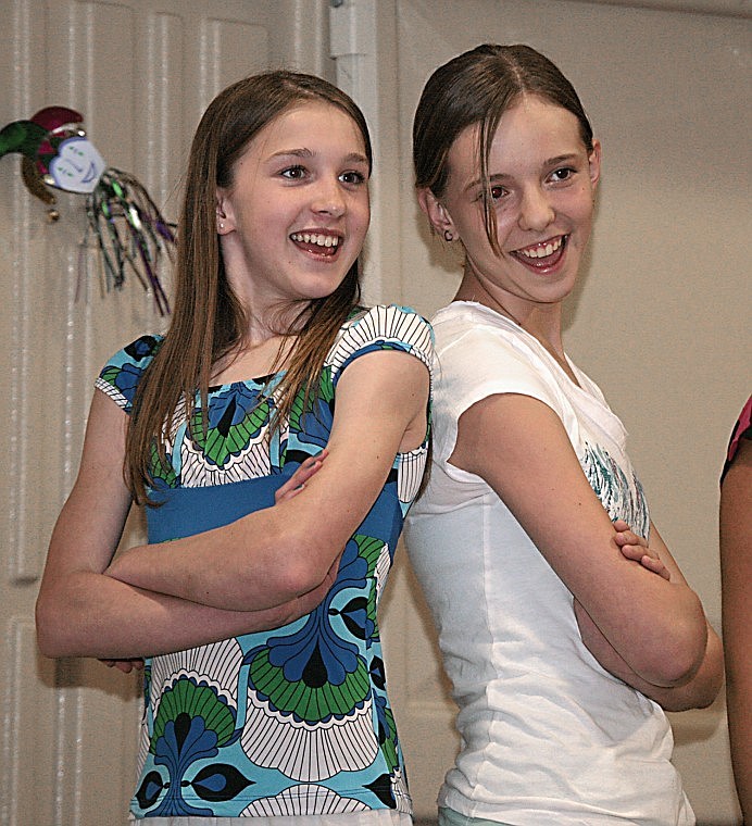 Junior High School Choir members Katelyn Revis and Elizabeth Morigeau perform &quot;Stop! In the Name of Love&quot; at the Arlee Coffee House Thursday night.