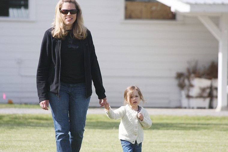 Krista Neibauer and daughter Morgan take a lap for diabetes.