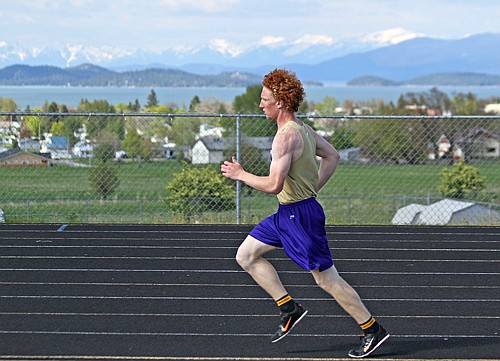 Jimmy Bjorge runs the 1,600-meter race for the Polson Pirates.