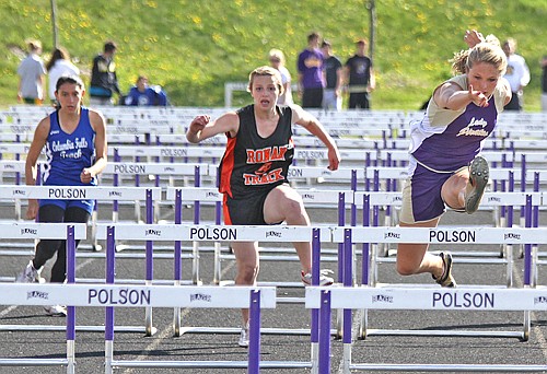 Breanne Kelley from Polson and Stephanie Lewandowski from Mission face off in the hurdles.