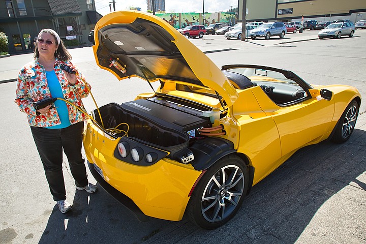 &lt;p&gt;Deb Fisher, of Coeur d'Alene, shows the charging options for her electric Tesla Roadster. Tesla Motors will have a model available to view and test drive at the Coeur d'Alene Resort on Saturday at 10 a.m.&lt;/p&gt;