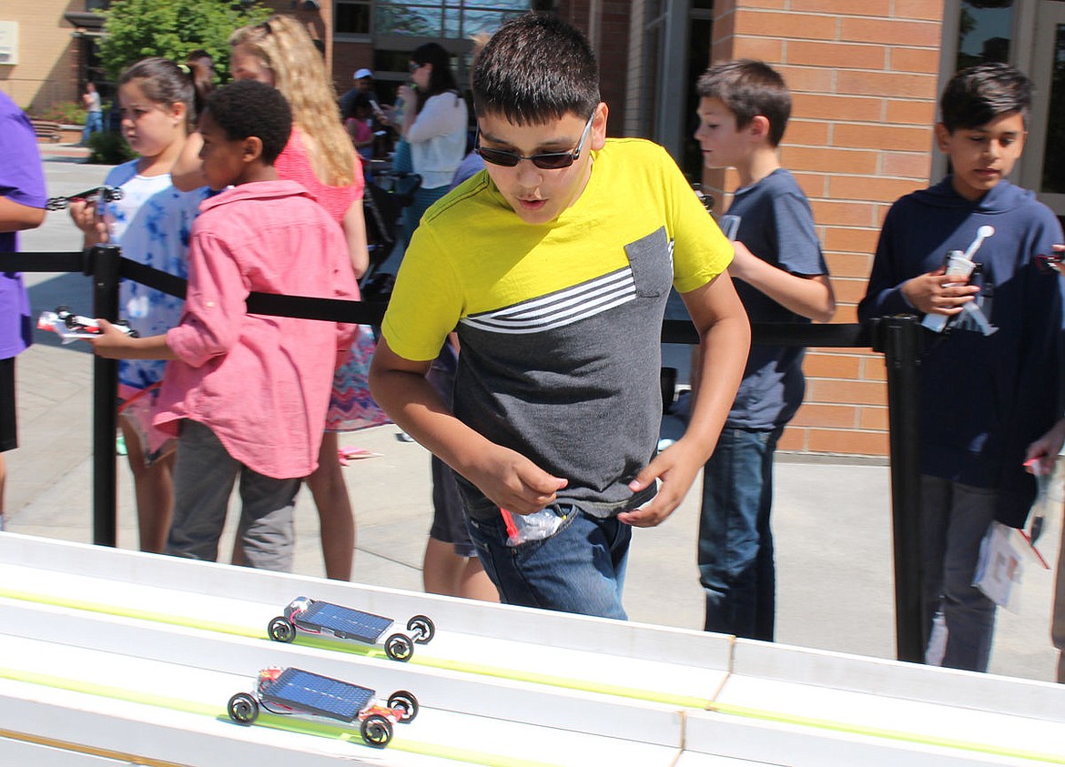 Fifth-graders chased their solar cars down the track during the Solar Car Races/Energy Fair Wednesday.