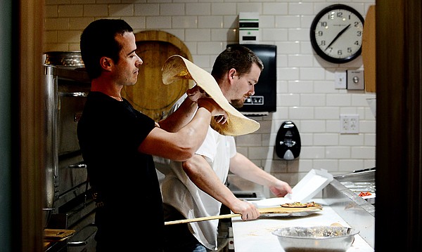 &lt;p&gt;Engjell Vrapi and Robert Hawkins make pizzas on Wednesday, May 22, at the new Kalispell location of When in Rome located on First Avenue East. (Brenda Ahearn/Daily Inter Lake)&lt;/p&gt;