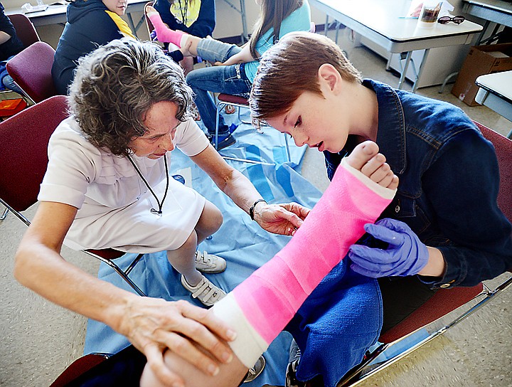 &lt;p&gt;Kathy Owen, left, a retired registered nurse, helps eighth grader Madison Neuman from Eureka Middle School as she wraps a cast at the Expanding Your Horizons 2014 event on Tuesday, May 20, at Flathead Valley Community College. (Brenda Ahearn/Daily Inter Lake)&lt;/p&gt;