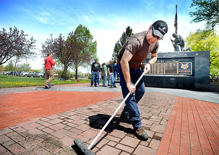 &lt;p&gt;Sean Reynolds and other members of the Flathead Marines work to clean up the veterans memorial on May 17 at Depot Park in Kalispell. The Flathead Marines have volunteered to take over the job of cleaning and caring for the memorial, saving the Flathead County Memorial Board approximately $3,500 per year. &#147;It was amazing how many veterans came up to us as we were working and asked if they could help,&#148; said Patrick Ward. &#147;And we said, &#145;Yes, of course.&#146; This is not about the Marines, this is a memorial for all of us.&#148;&lt;/p&gt;