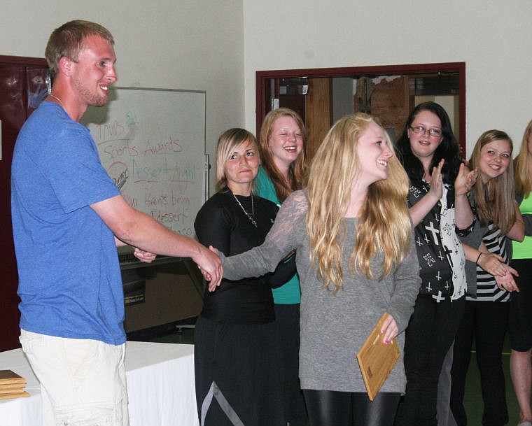 &lt;p&gt;St. Regis High School Athletic Director Tyler Hurley presents Jasmine Jones with a plaque for her accomplishments with the girls basketball team this season.&#160;&lt;/p&gt;