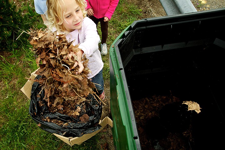 &lt;p&gt;JEROME A. POLLOS/Press Natalie Rouse, a first-grade student at Ramsey Magnet School of Science, throws a handful of leaves and pine needles into a compost bin at the school Wednesday. Students were learning about composting for their science unit and received a grant from the EXCEl Foundation to fund the hands-on portion of the curriculum.&lt;/p&gt;