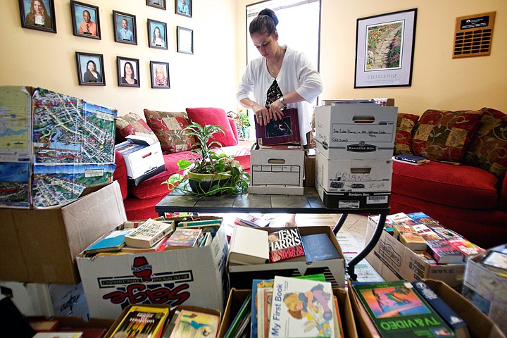 &lt;p&gt;JEROME A. POLLOS/Press Kat Farrelly sorts through more than 4,000 books Wednesday donated by her fellow employees at the Coeur d'Alene office of Center Partners. The company originally set a 1,000-book goal for the one-month book drive that would support the Community Library Network. &quot;Their overwhelming generosity will have ripple effects throughout our communities,&quot; said Karen Yother, youth services coordinator for the Community Library Network.&lt;/p&gt;