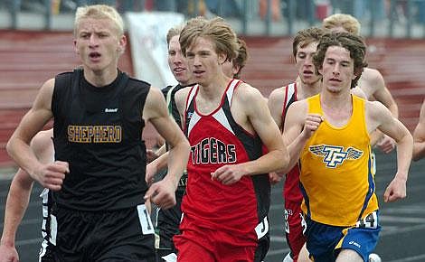 Photo by Trent Makela Bluehawk senior Shane Donaldson fights his way through a crow in the 1,600-meter relay at the Class B state championship in Bozeman this weekend.