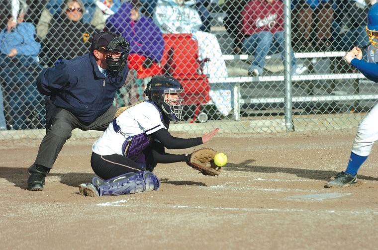 Junior catcher Kayla Duford blocks the ball in Polson's win over Libby earlier in the month.