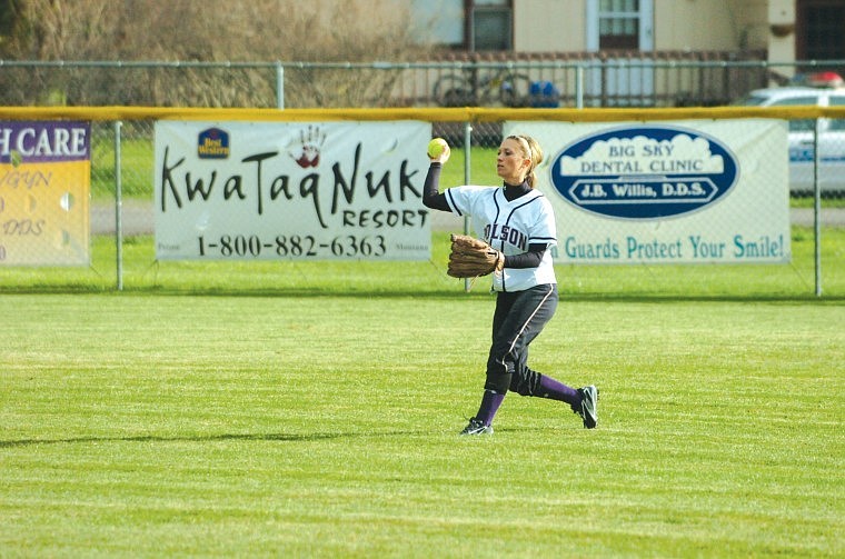 Junior Kodi Woods retrieves a ball that went into the outfield in Polson's game against Libby earlier this season.