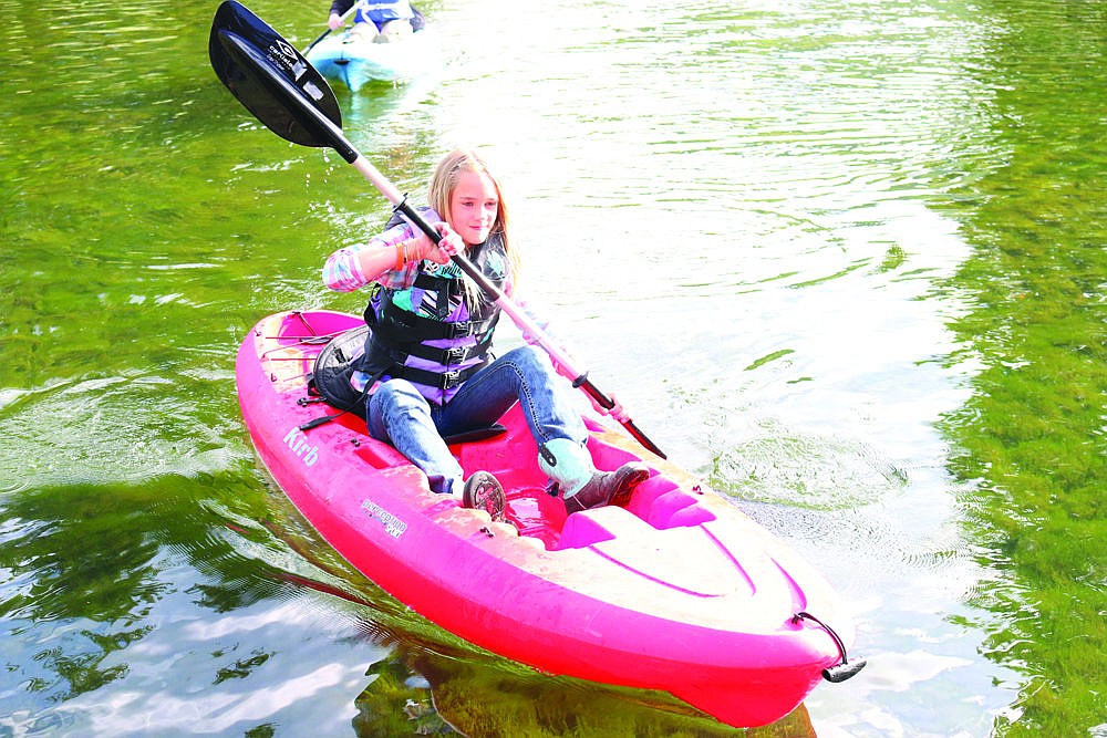 <p>Kylie Plakke paddles on the pond at the Savenac Nursery during the Superior Outdoor Week.</p>