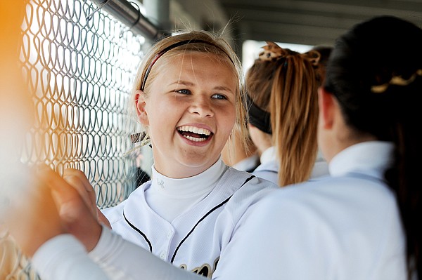 &lt;p&gt;Helena Capital Bruins junior Quinci Robertson (22) smiles at her teammates as she yells encouragement from the dugout during the second inning of a quarterfinal game against Great Falls C.M. Russell on Friday afternoon at the 2012 State Class AA Softball Tournament in Kalispell. The Bruins started the inning down 7-0. By the end of the inning they had scored six runs, starting with a grand slam by Robertson. Robertson has been playing softball since sixth grade. This was her first home run. Two more home runs followed by seniors Jayden Tripp (19) and Anna Morgan (11) bringing the score at the end of the inning to 7-6.&lt;/p&gt;