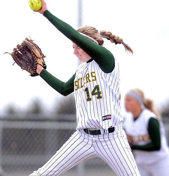 <p>Great Falls C.M. Russell pitcher Quinn Hartman (14) during the semifinal game against the Great Falls Bison on Saturday afternoon at the 2012 State Class AA Softball Tournament in Kalispell. CMR won the game 7-5.</p>