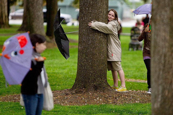 &lt;p&gt;SHAWN GUST/Press Harper Robnett, Sorenson Magnet School fourth-grader, hugs a tree Thursday during trip to the Coeur d'Alene City Park for the school's fourth grade picnic. Despite wet weather, more than 50 students walked to the park before the long holiday weekend.&lt;/p&gt;