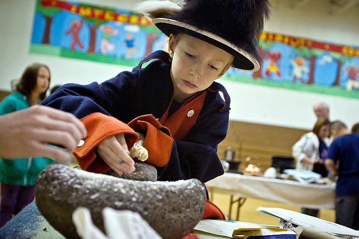 &lt;p&gt;JEROME A. POLLOS/Press Brandon Shaw, 10, tries his hand at grinding corn with stones during a Lewis and Clark hands-on display Monday at Ponderosa Elementary. The event was organized by the Lewis and Clark Trail Heritage Foundation and the Idaho Department of Lands.&lt;/p&gt;