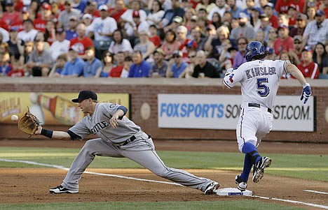 &lt;p&gt;Seattle Mariners first baseman Justin Smoak (17) catches the ball to force out Texas Rangers' Ian Kinsler (5) in the first inning of a baseball game in Arlington, Texas, Monday, May 28, 2012. (AP Photo/Brandon Wade)&lt;/p&gt;