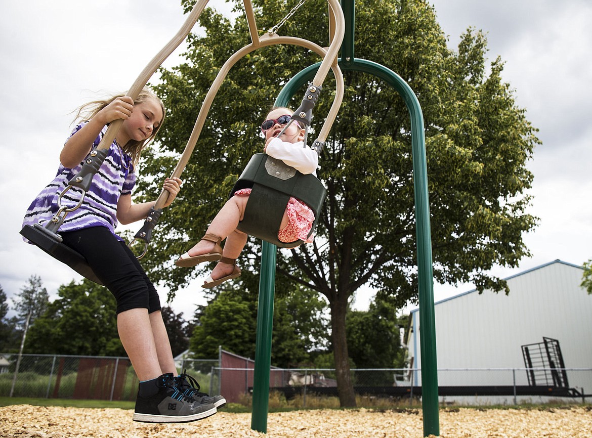 &lt;p&gt;Gianna Jenkins, 9, and Kira Maiuri, 2, sway back-and-forth on a swing dedicated to their great grandfather, Jim Edinger, on Saturday at Sunset Park. Edinger, who was an umpire for Parks and Recreation for 35 years, is survived by five children together with Marie, 12 grandchildren, 12 great-grandchildren and one great-great-grandchild.&lt;/p&gt;