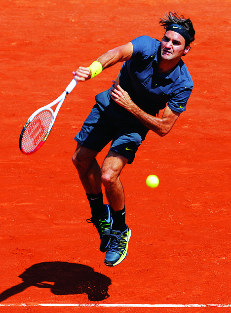 &lt;p&gt;Switzerland's Roger Federer serves the ball to Germany's Tobias Kanke during their first round match in the French Open tennis tournament at the Roland Garros stadium in Paris, Monday, May, 28, 2012. (AP Photo/Bernat Armangue)&lt;/p&gt;