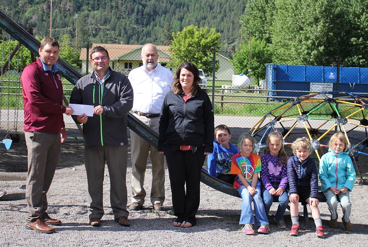 &lt;p&gt;Alberton school principal, Kyle Fisher, accepts a $15,000 check from Jim Bieber and Brittney Gardner with the Washington Foundation, along with Superintendent, Clay Acker and students. The check is for new playground equipment which will be installed later this month.&lt;/p&gt;