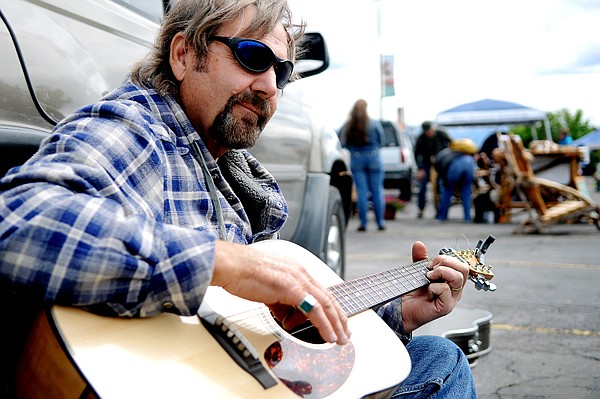 &lt;p&gt;Robert Dent of Kalispell plays the guitar at the Kalispell Farmers Market on Saturday, May 26.&lt;/p&gt;