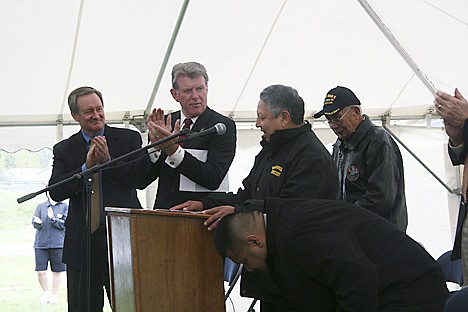 &lt;p&gt;From left, U.S. Sen. Mike Crapo and Gov. Butch Otter congratulates Coeur d'Alene Tribe vice chairman Ernie Stensgar for his work on the veterans memorial in Plummer, which was dedicated during a ceremony Saturday. Pictured at right is tribal elder Felix Aripa, who served in World War II, and said a prayer during the ceremony.&lt;/p&gt;