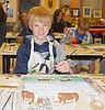Artist works with students