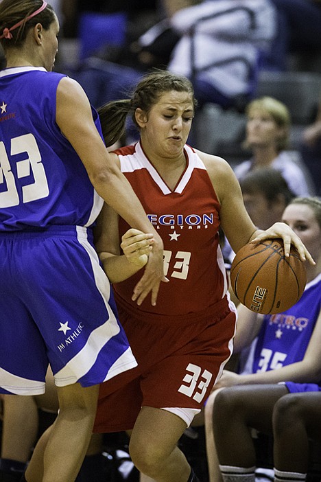 <p>Hallie Gennett, of Post Falls, is fouled by Metro's Brooke Reilly after receiving a pass near the sideline.</p>