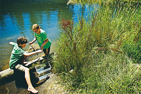 &lt;p&gt;Noah Reynolds, 13, left and Savannah Carr, 11, finish their fishing trip at the Falls Park and gather their things to meet up with the rest of their group Friday, Aug. 3, 2012, in Post Falls.&lt;/p&gt;