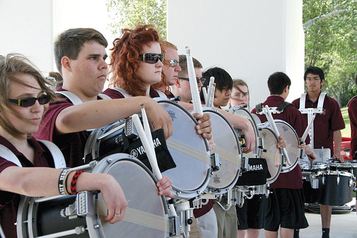 Members of the Moses Lake High School marching band perform Friday afternoon at the kickoff of the Spring Festival.