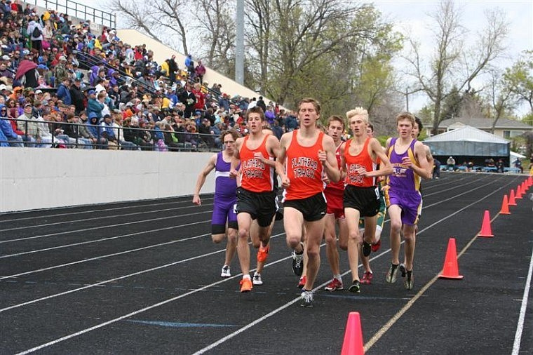 FLATHEAD&#146;S LEIF CASTREN (front) leads a tightly packed group of runners during Saturday&#146;s 1,600. Teammate Jesse Bennett (left) went on to win the race, while Zach Perrin (right) placed sixth. Castren came in second.