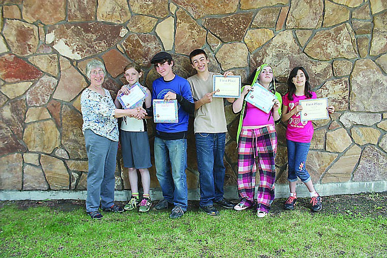 &lt;p&gt;Ellen Childress, Plains Woman's Club Creative Writing Contest chairperson, awards students Torrance Peacock, Jubal Ryan, Jake Lile, Amanda Marjerrison and Yumna Jane Mossad with cash prizes and award certificates.&#160;&lt;/p&gt;