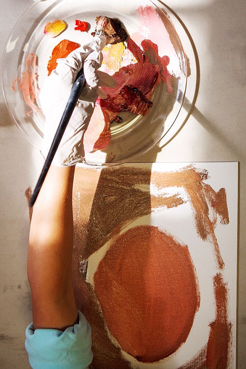 <p>A student works on a portrait during an oil painting class May 23 at the new art school Glacier Art Academy in the KM Building in Kalispell.</p>