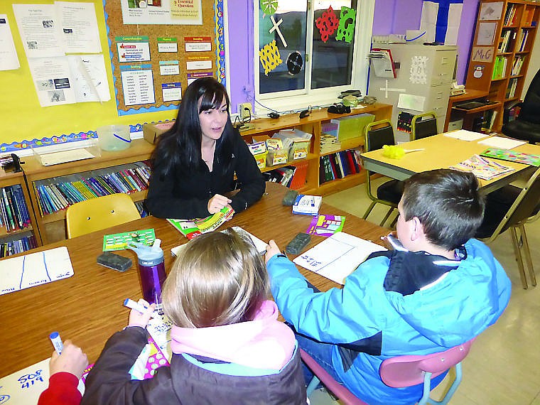 &lt;p&gt;Volunteer Mary Ann Foster helps a group of Hot Springs students as part of a new learning experience the school offers.&lt;/p&gt;