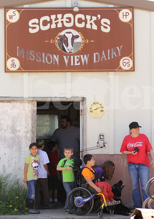 &lt;p&gt;St. Ignatius second graders, from left, Elannah Flatlip, Damien Durglo, Xavier Christensen, and &#160;Kandi Davis of St. Ignatius,&#160;prepare to enter the milking barn while visiting the Schock's Mission View Dairy in St. Ignatius.&lt;/p&gt;