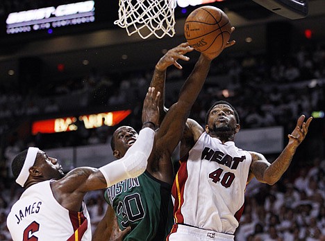 &lt;p&gt;Miami Heat's Udonis Haslem (40) and LeBron James (6) pressure Boston Celtics' Brandon Bass (30) as he drives to the basket during the second half of Game 2 in their NBA basketball Eastern Conference finals playoffs series, Wednesday, May 30, 2012, in Miami. (AP Photo/Lynne Sladky)&lt;/p&gt;