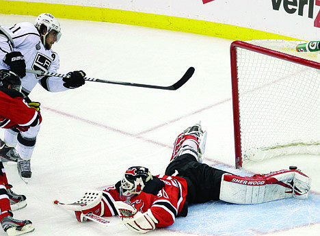 &lt;p&gt;Los Angeles Kings' Anze Kopitar (11), of Slovenia, shoots a puck past New Jersey Devils goalie Martin Brodeur (30) for the winning goal in overtime of Game 1 of the NHL hockey Stanley Cup finals Wednesday, May 30, 2012, in Newark, N.J. (AP Photo/Frank Franklin II)&lt;/p&gt;