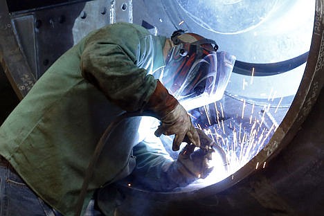 &lt;p&gt;A man welds parts in fans for industrial ventilation systems at the Robinson Fans Inc. plant in Harmony, Pa., on Feb. 12.&#160;&lt;/p&gt;