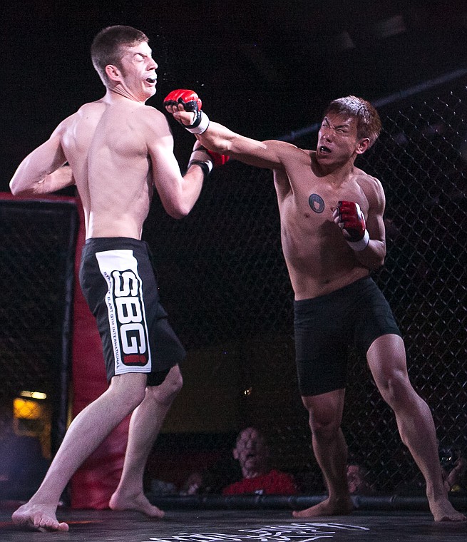 <p>Dakota Tackett fights Leo Shoji Friday night during Kalispell Kombat mixed martial arts fights at Majestic Valley Arena. May 30, 2014 in Kalispell, Montana. (Patrick Cote/Daily Inter Lake)</p>