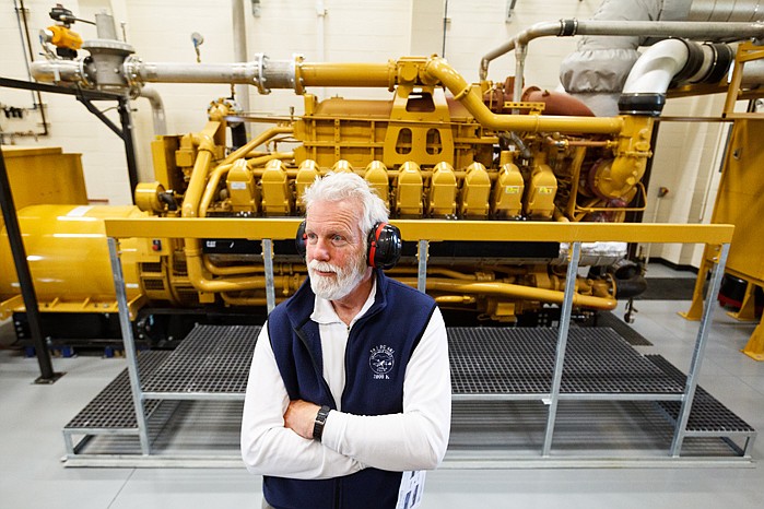 &lt;p&gt;SHAWN GUST/Press Dwight McCain ponders the working of a 20-cylinder engine as a second runs behind him during a tour of the newly opened gas-to-energy facility Wednesday at the Fighting Creek Landfill.&lt;/p&gt;