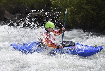 <p>A kayaker goes over a rapid at the start of the giant slalom kayak race of the 41st annual Bigfork Whitewater Festival on Saturday. (Aaric Bryan/Daily Inter Lake)</p>