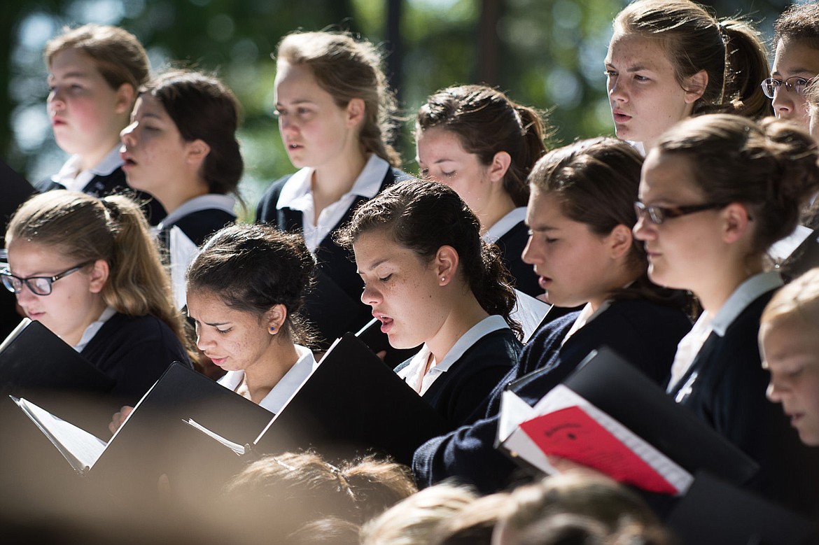 &lt;p&gt;Girls from the Saint Dominic Choir sing at the Post Falls Memorial Day ceremony on Monday.&lt;/p&gt;